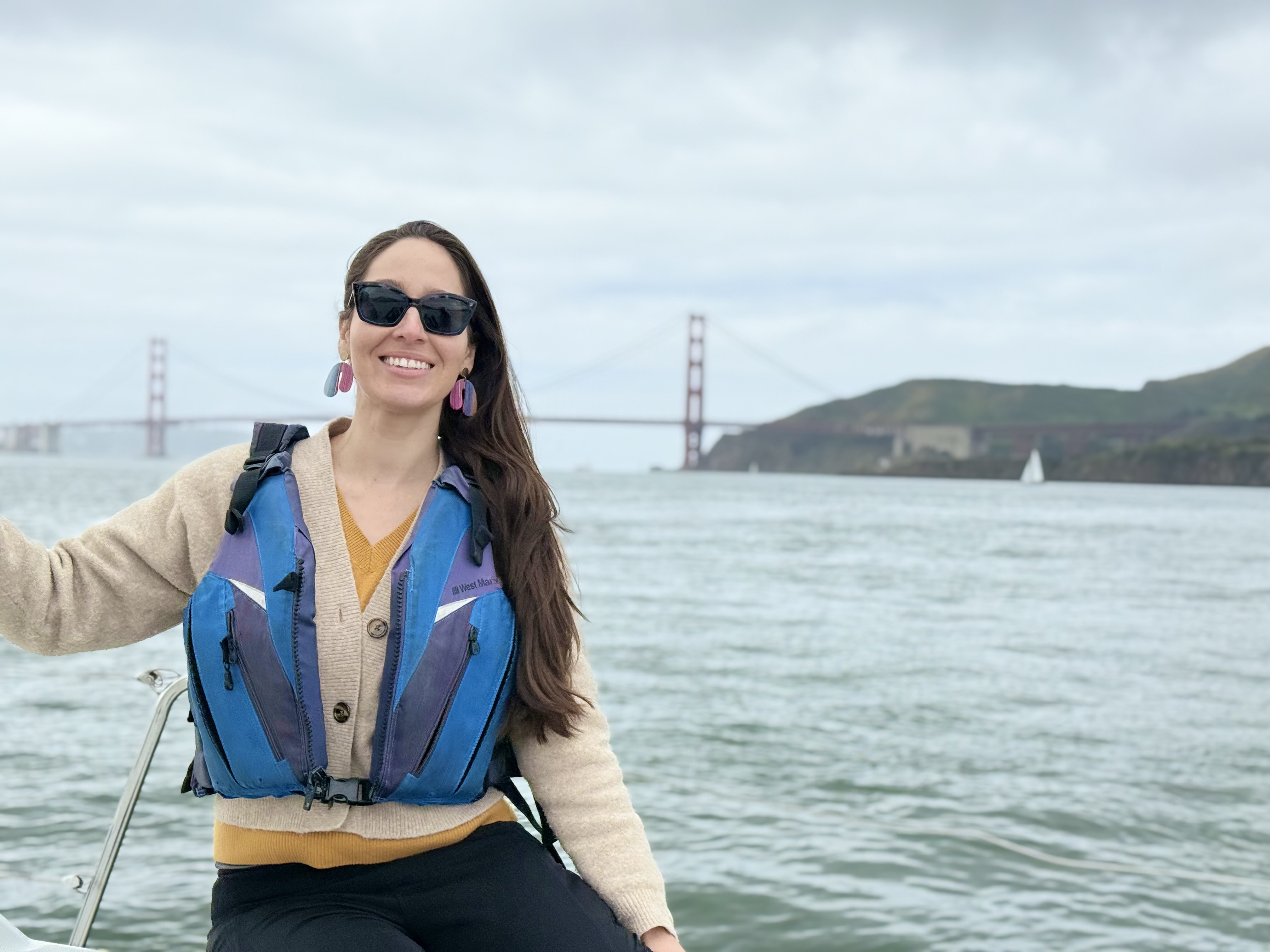 Samantha on a boat with the Golden Gate Bridge in the background