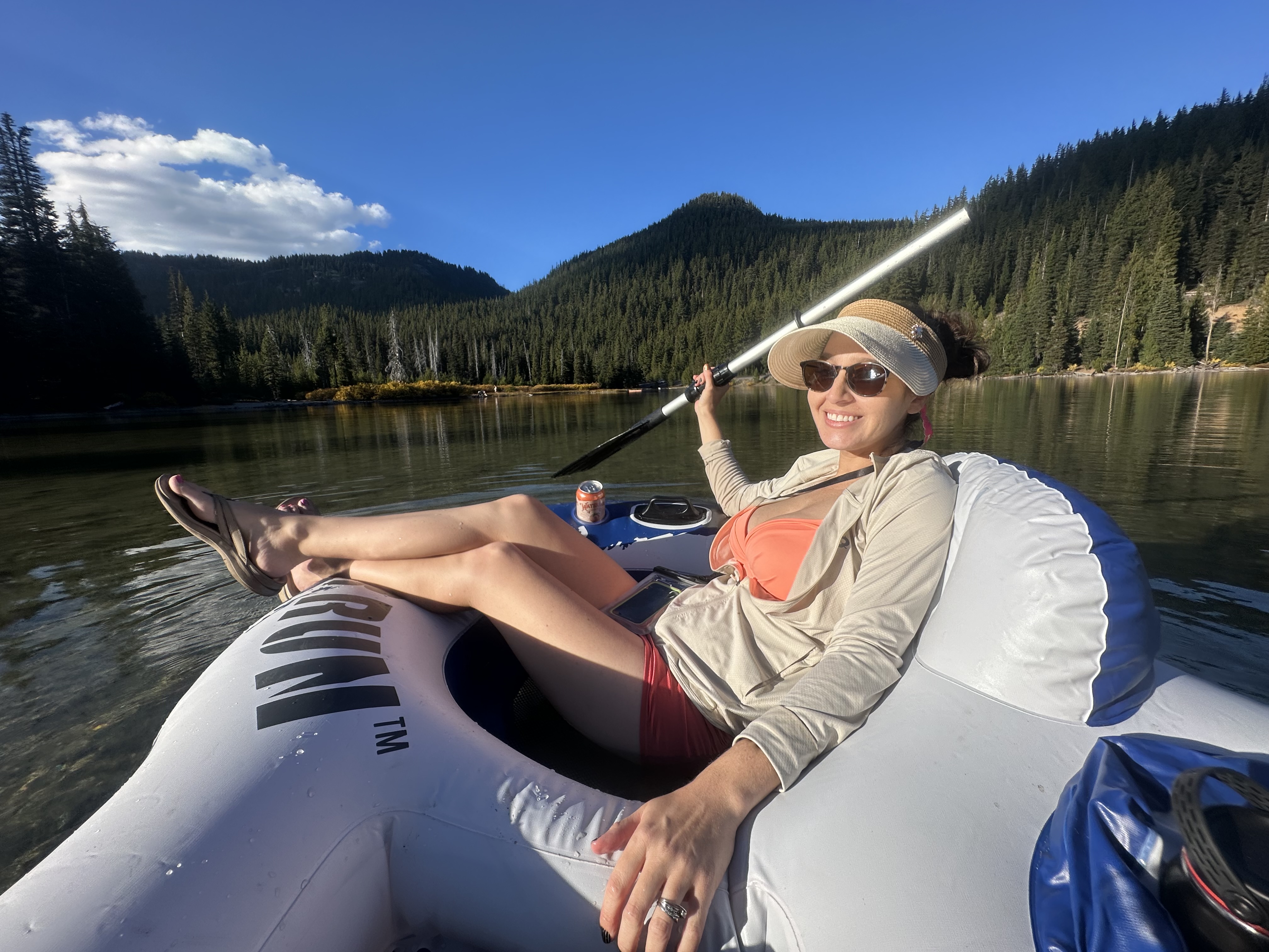 Samantha relaxing on an inflatable raft on a calm lake