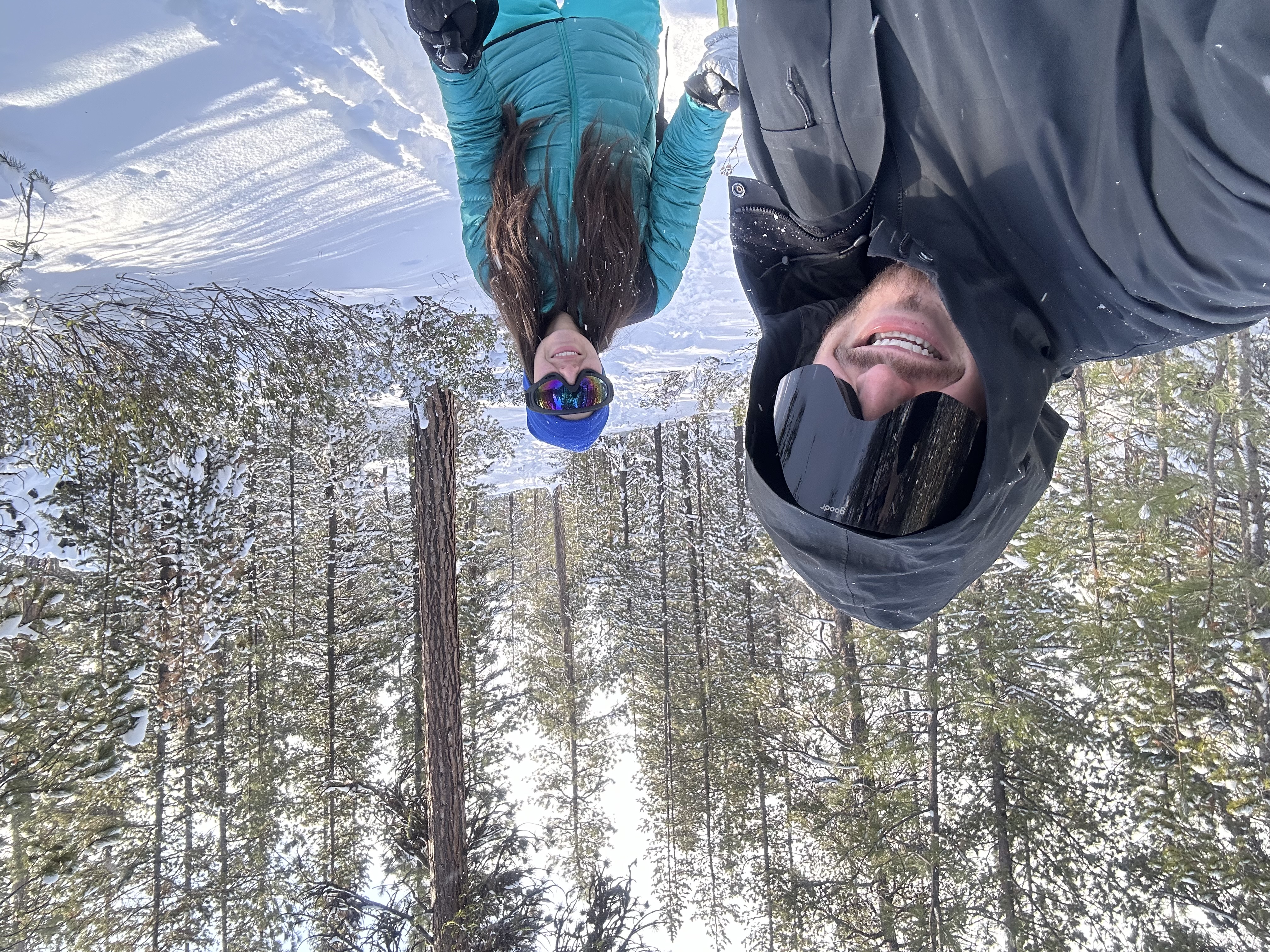 Samantha in winter gear standing in snowy trees